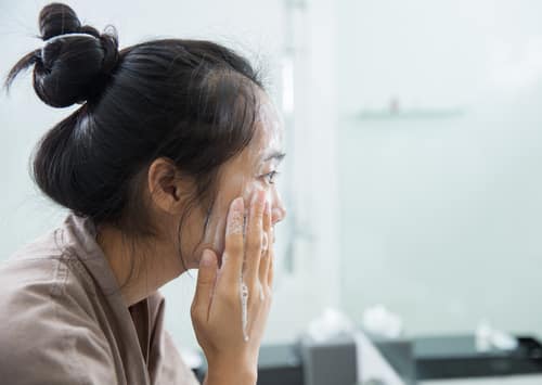 Woman washing face